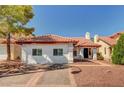 Charming home with a red tiled roof, a stone driveway, and meticulously manicured landscaping at 8924 Sail Bay Dr, Las Vegas, NV 89117