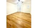 Bright bedroom with light wood flooring, ceiling fan, and lots of natural light at 10372 Beautiful Fruit St, Las Vegas, NV 89183
