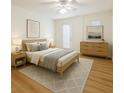 Bright bedroom featuring a ceiling fan, natural light, and modern decor at 10372 Beautiful Fruit St, Las Vegas, NV 89183
