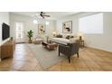 Comfortable living room features neutral tones, modern furniture, and bright natural light at 10372 Beautiful Fruit St, Las Vegas, NV 89183