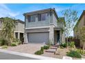 Charming two-story home with landscaped yard and a two-car garage, offering curb appeal at 12426 Oregon Cherry Ave, Las Vegas, NV 89138