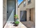 Inviting front door with a charming walkway and mature landscaping, enhancing curb appeal at 12426 Oregon Cherry Ave, Las Vegas, NV 89138