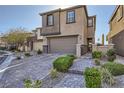 Charming two-story home boasting a manicured front yard and attached two-car garage at 12532 Blissful Sky St, Las Vegas, NV 89138