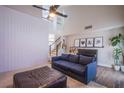 Comfortable living room space with open floorplan and view of stairs at 1508 Silver Knoll Ave, Las Vegas, NV 89123