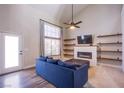 Cozy living room features a fireplace, open shelving and large bright window at 1508 Silver Knoll Ave, Las Vegas, NV 89123