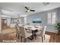 Dining area with a stylish table, elegant chairs, and ample natural light at 165 Calm Morning Ave, Henderson, NV 89002