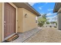 Inviting front door with decorative mat and paved walkway at 2104 Leatherbridge Ct, North Las Vegas, NV 89081