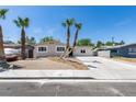 Single story home with concrete driveway and desert landscaping at 212 View Dr, Las Vegas, NV 89107
