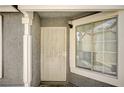 Inviting entryway showcasing a secure white security door and a sidelight window at 2377 Los Feliz St, Las Vegas, NV 89156