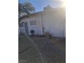 The front of this home has a barred front door and window, xeriscaping, and block wall at 2888 El Cajon St, Las Vegas, NV 89169