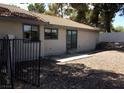 View of the home's exterior with tile roof and fenced backyard at 3948 Applecrest St, Las Vegas, NV 89108