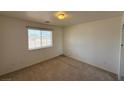 Cozy bedroom with neutral carpet and a bright window at 4330 Turner Blvd, Pahrump, NV 89061