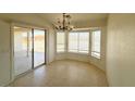 Dining area with tile flooring, chandelier and sliding door at 4330 Turner Blvd, Pahrump, NV 89061