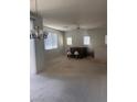 Spacious bedroom featuring neutral carpet, recessed lighting, and natural light from multiple windows at 6158 Calm Breeze Ave # 101, Las Vegas, NV 89108