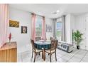 Bright dining area featuring natural light and tile flooring at 694 Last Dance Pl, Henderson, NV 89011