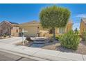Inviting single-story home with well-maintained landscaping and a spacious driveway at 7720 Fruit Dove St, North Las Vegas, NV 89084