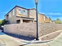 House backyard featuring a large, well-maintained concrete block wall at 81 Sertata Ct, Henderson, NV 89074