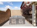 Modern hot tub in backyard with brick surround at 10617 Tuckermans Ave, Las Vegas, NV 89129