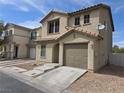 Charming two-story home with a red tile roof and low-maintenance desert landscaping at 1144 Black Cherry St, Las Vegas, NV 89142