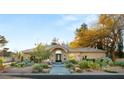 Charming home with desert landscaping, mature trees, and an inviting walkway at 1234 Campbell Dr, Las Vegas, NV 89102