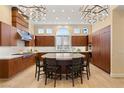 Spacious kitchen with stainless steel appliances, marble countertops, and a large central island at 1234 Campbell Dr, Las Vegas, NV 89102