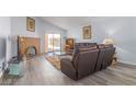 Cozy living room featuring a brick fireplace, neutral decor, and sliding glass door at 1900 Cameron St, Las Vegas, NV 89102