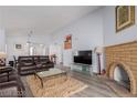 Spacious living room with a decorative fireplace, TV, and comfortable seating area at 1900 Cameron St, Las Vegas, NV 89102