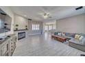 Bright living area with a fireplace, tile floors, recessed lighting, and lots of natural light at 2171 Deadwood St, Pahrump, NV 89048