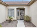 Inviting front entrance with decorative security door, desert landscaping, and a paved walkway at 2999 Gettysburg Ave, Henderson, NV 89052