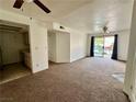 Open-concept living room showcases neutral carpet and access to kitchen at 3550 Bay Sands Dr # 1005, Laughlin, NV 89029