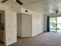 Inviting living room featuring neutral carpet and a sliding glass door to the balcony at 3550 Bay Sands Dr # 1005, Laughlin, NV 89029