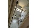 Updated bathroom features a shower-tub combo, marble style tile and modern fixtures at 3700 Hickey Ave, North Las Vegas, NV 89030