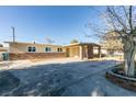 Single-story home with stone accents, a covered front porch, and low-maintenance landscaping at 3700 Hickey Ave, North Las Vegas, NV 89030