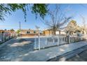 Charming single-story home with white picket fence and low-maintenance landscaping at 3700 Hickey Ave, North Las Vegas, NV 89030