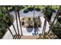 Aerial view of landscaped front yard featuring mature palms and desert landscaping at 4012 Vegas Dr, Las Vegas, NV 89108