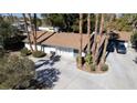 Aerial view of home with long driveway and multiple parking spaces at 4012 Vegas Dr, Las Vegas, NV 89108