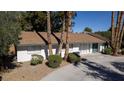 Charming single-story home with mature palm trees and desert landscaping at 4012 Vegas Dr, Las Vegas, NV 89108