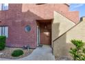 Attractive front entrance with desert landscaping and an inviting covered entryway at 4050 Pacific Harbors Dr # 112, Las Vegas, NV 89121