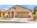 Charming single-story home featuring a low maintenance front yard and attached two car garage at 4071 Blue Manor Ln, North Las Vegas, NV 89032