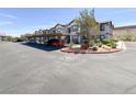 Exterior view of the assigned, covered parking area and well-maintained landscaping at 45 Maleena Mesa St # 1424, Henderson, NV 89074