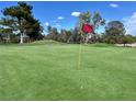 Scenic golf course view with lush green fairway and mature trees at 5436 Red Sun Dr, Las Vegas, NV 89149
