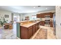 Modern kitchen featuring a breakfast bar, stainless steel appliances, and sleek cabinetry at 5500 E Volterra Dr, Pahrump, NV 89061