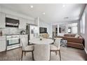 Bright, open floor plan with views of the modern kitchen and living spaces at 5575 Cresent Valley St, Las Vegas, NV 89148