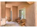 Cozy covered patio with seating, perfect for relaxing and enjoying the outdoors at 6046 Bassio Ave, Las Vegas, NV 89141