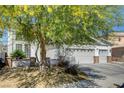 Charming two-story home with a three-car garage and mature tree at 6236 Desert Haven Rd, Las Vegas, NV 89130