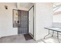 A secure condo entrance with a gated patio area and neutral color scheme at 6711 W Charleston Blvd # 4, Las Vegas, NV 89146