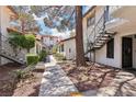 Landscaped condo community with walkways and multiple stairways at 6711 W Charleston Blvd # 4, Las Vegas, NV 89146