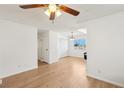 Bright living area featuring wood flooring, a ceiling fan and white walls at 6711 W Charleston Blvd # 4, Las Vegas, NV 89146