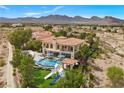 A beautiful home featuring a pool with a slide and a panoramic view of mountains and city at 9301 Verlaine Ct, Las Vegas, NV 89145