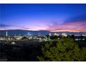 Scenic city skyline with the High Roller and other landmarks at dusk at 9301 Verlaine Ct, Las Vegas, NV 89145